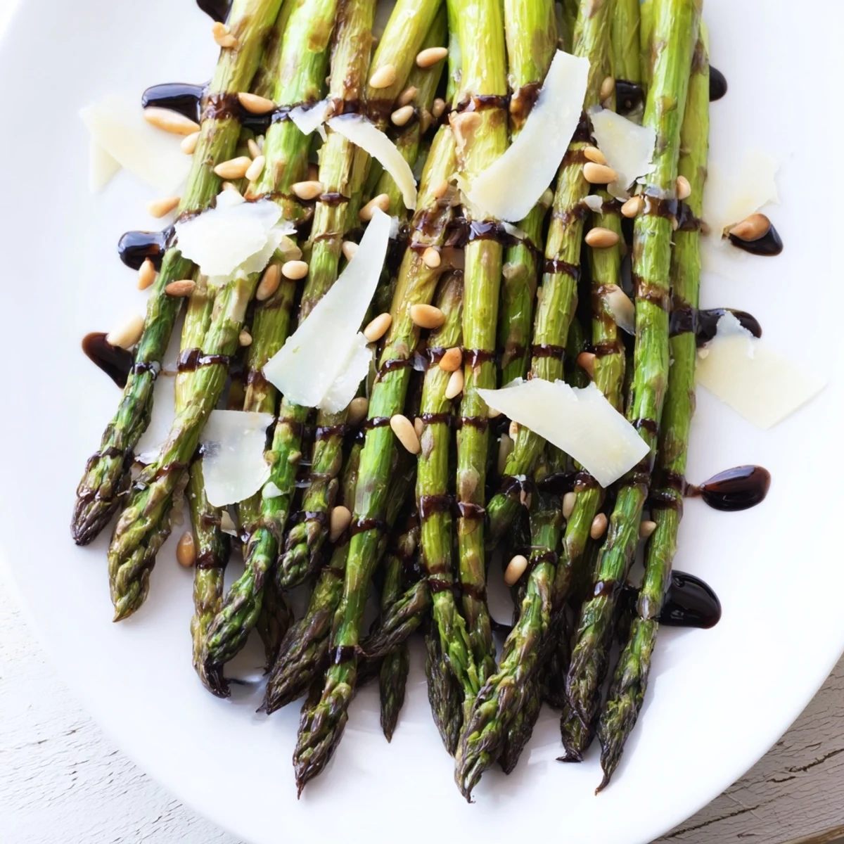 Vibrant Roasted Asparagus with Balsamic Glaze served fresh on a wooden board, showcasing tender green spears.
