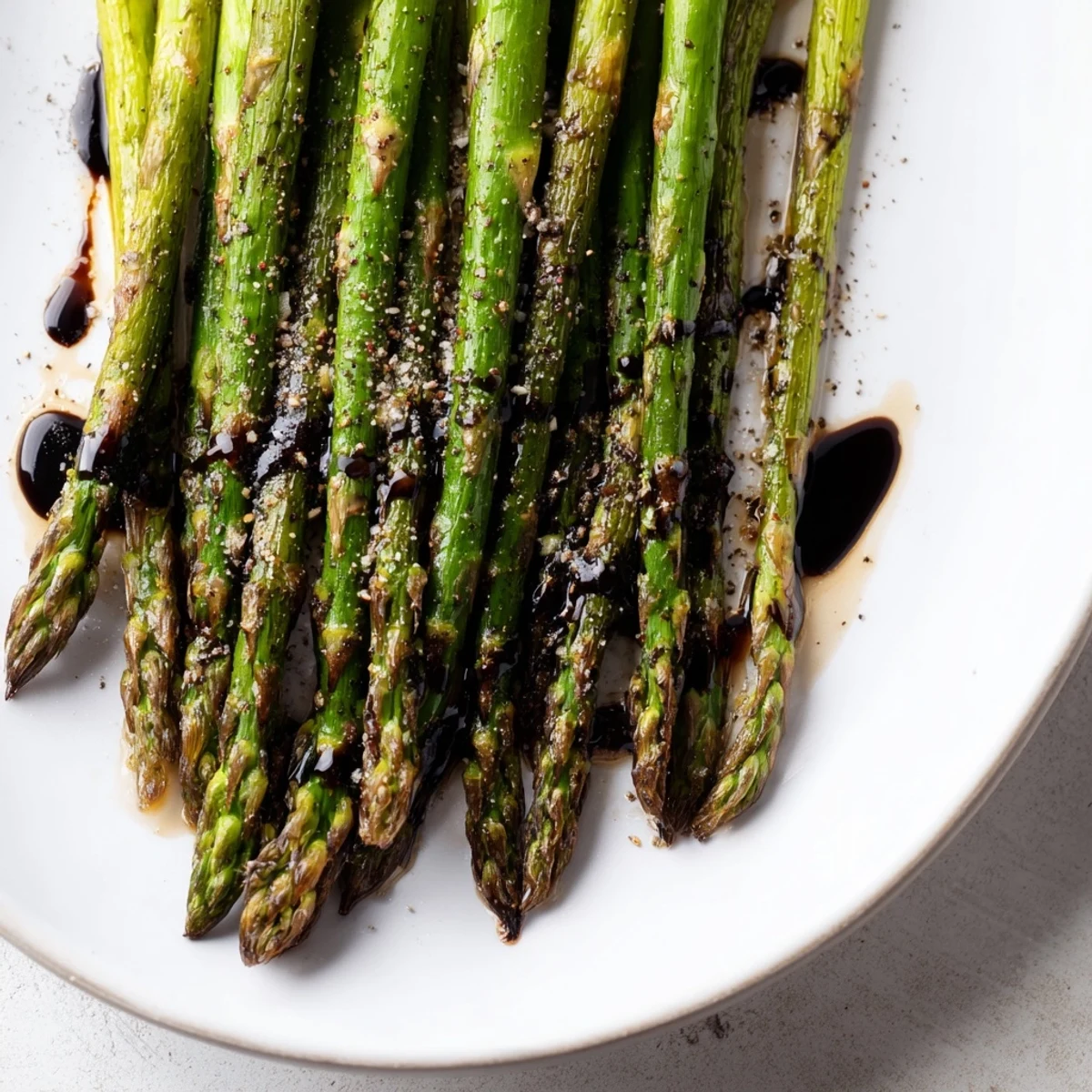 Golden roasted asparagus with balsamic reduction makes an elegant, vegan, gluten-free vegetable side.