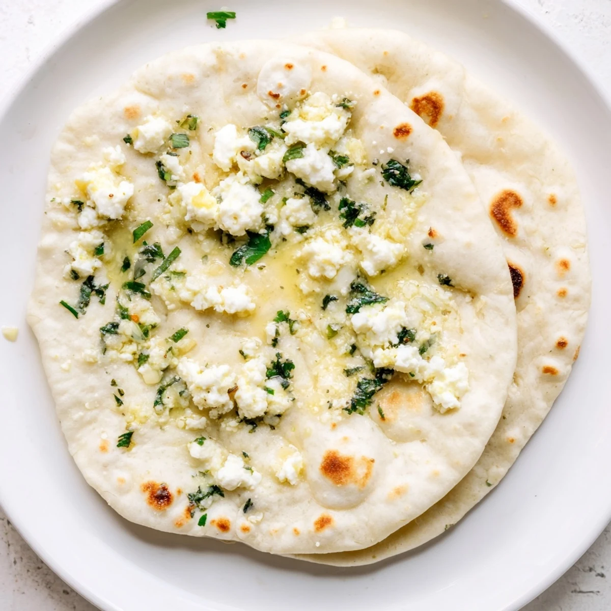Soft, pillowy Cottage Cheese Garlic Naan stuffed with creamy cottage cheese filling.
