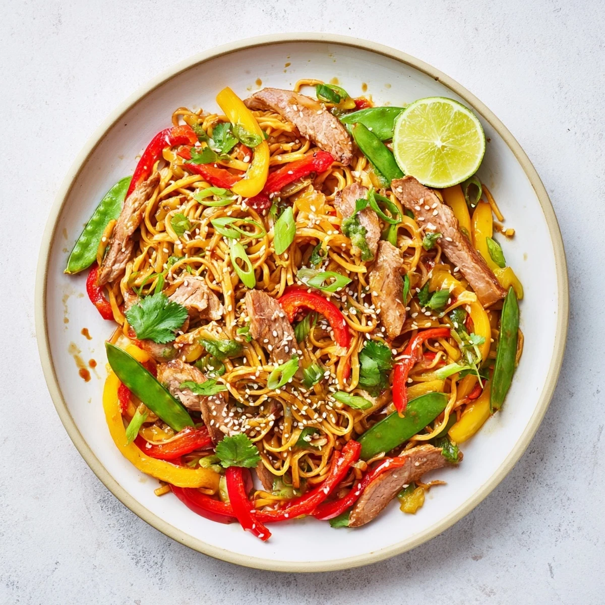 Wok-tossed Sweet Chilli Turkey Noodle Stir Fry featuring silky noodles, colorful veggies, and tangy sauce.