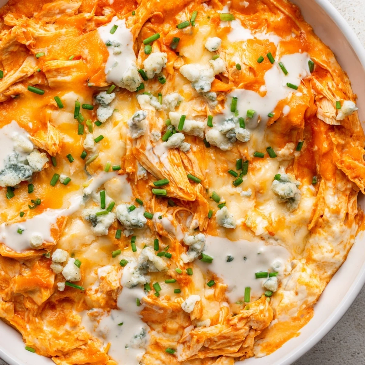 Golden bubbling Crockpot Buffalo Chicken Dip served with crispy tortilla chips for game day