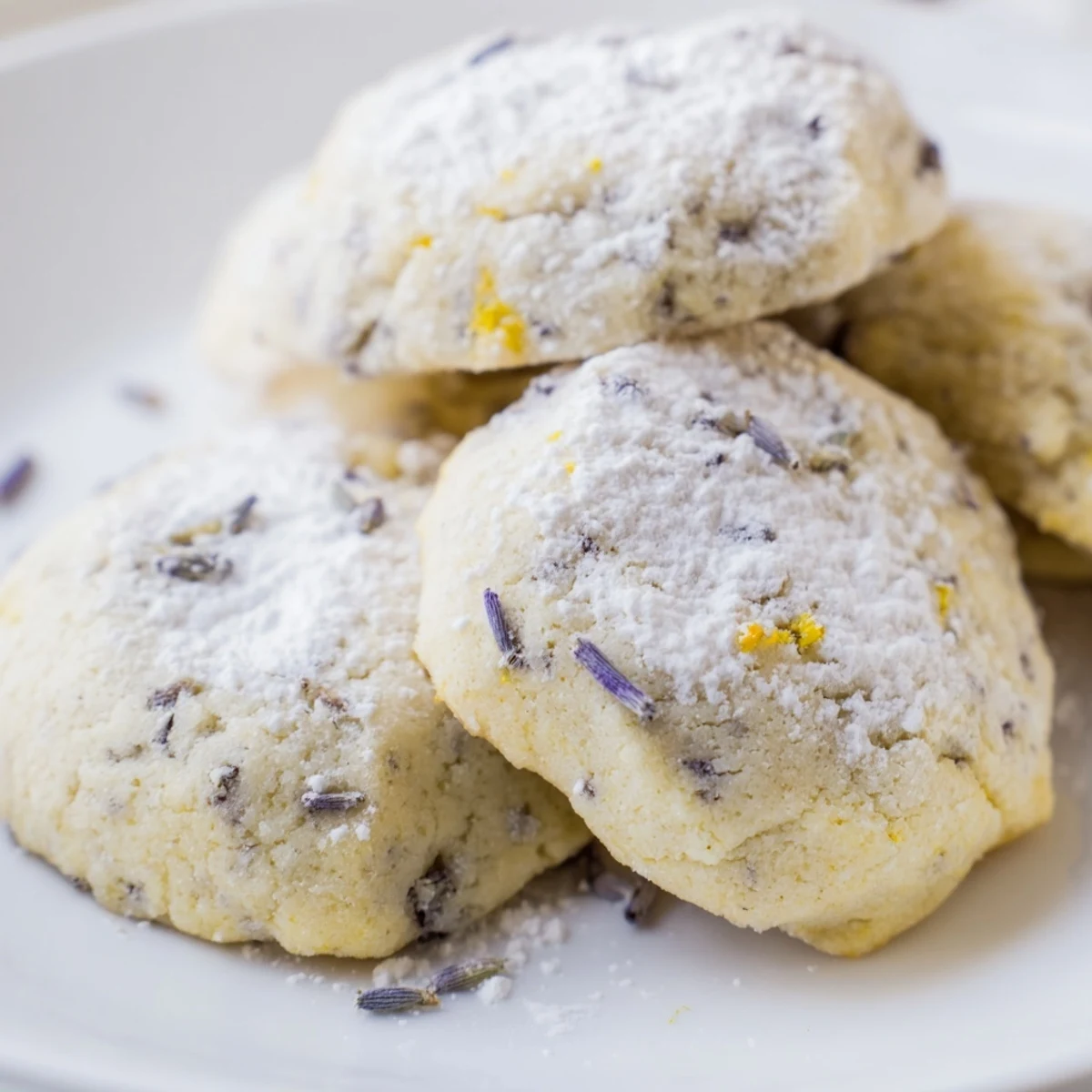 Golden lemon lavender cookies cooling on wire rack with light powdered sugar dusting