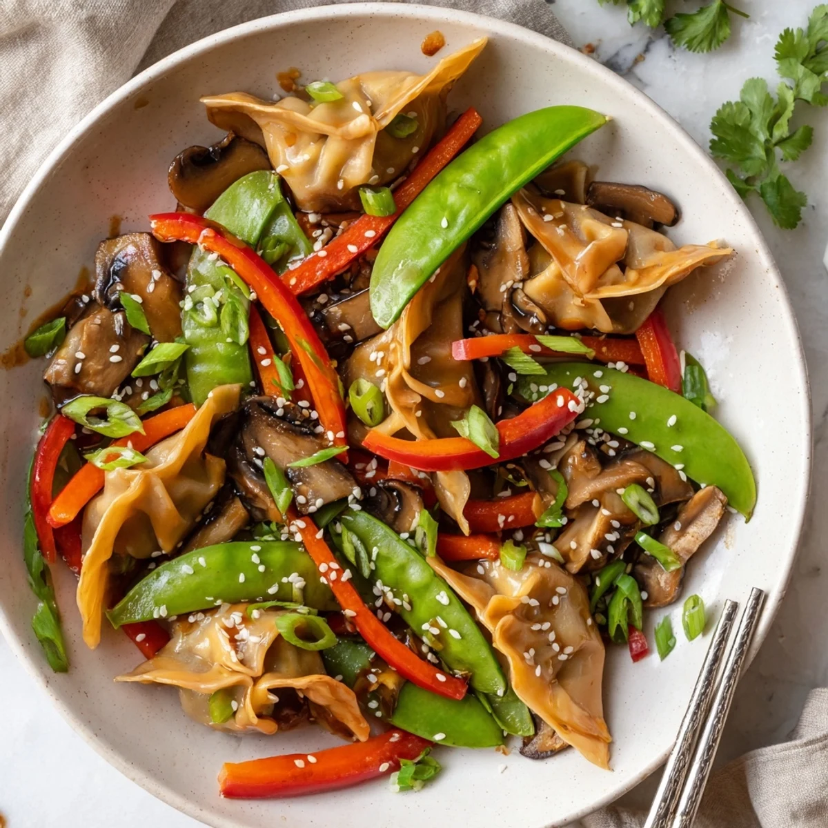 Crispy golden potstickers tossed with colorful vegetables in savory Asian stir fry sauce