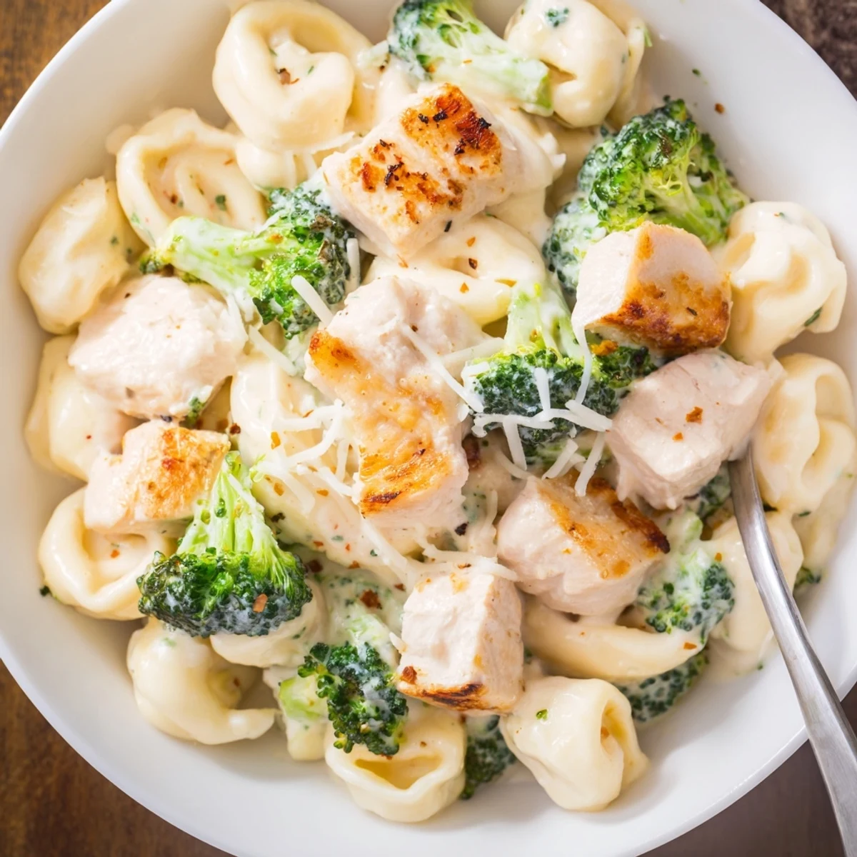 Creamy Garlic Parmesan Tortellini Chicken Broccoli Recipe skillet-tossed, aromatic garlic, cheese-sauced tortellini with chicken