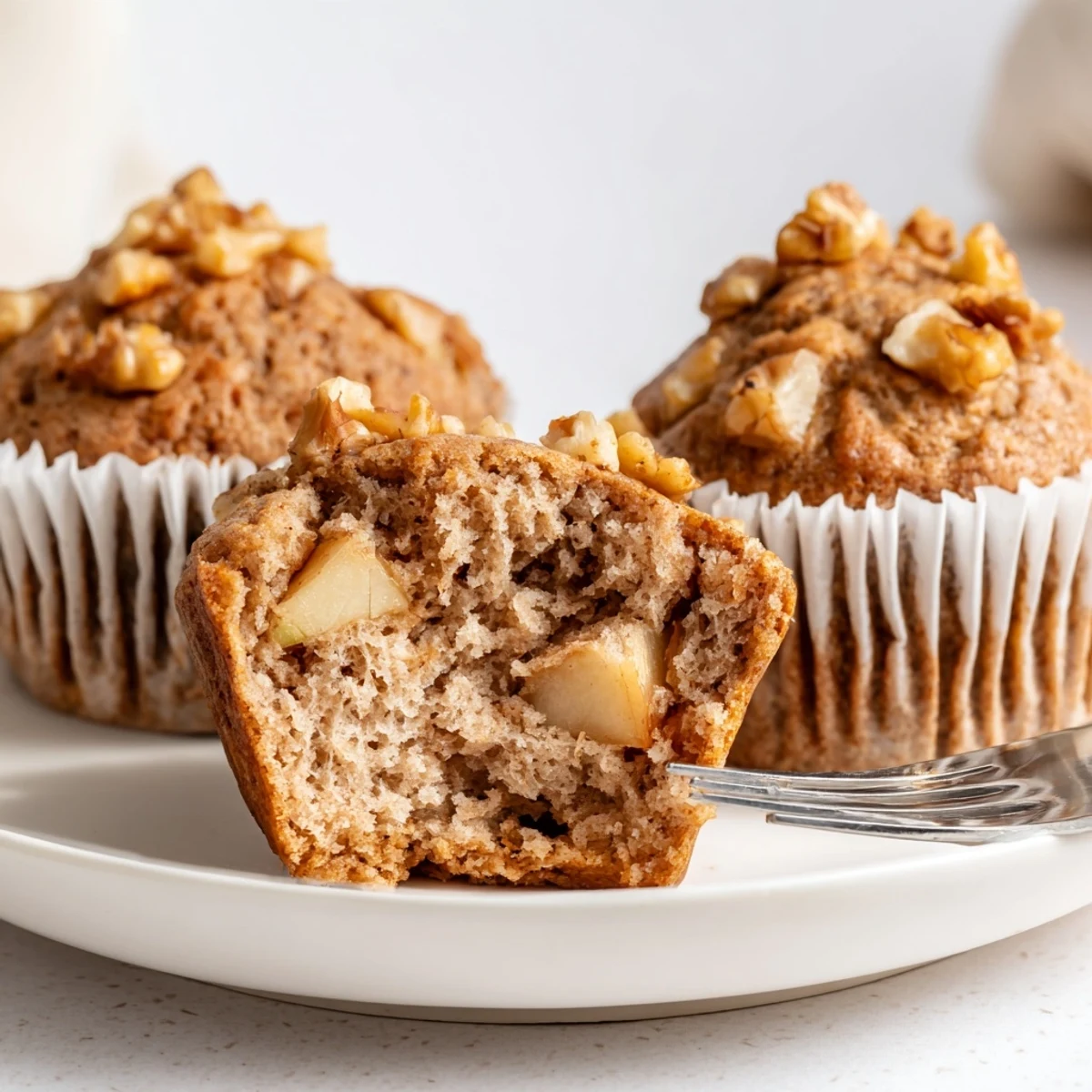 Healthy Apple Cinnamon Greek Yogurt Muffins cut open, moist crumb, honey drizzle