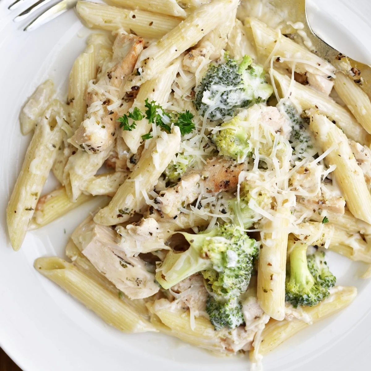 Creamy Chicken Broccoli Alfredo Bake glistening sauce, melted mozzarella, family-style weeknight dinner.