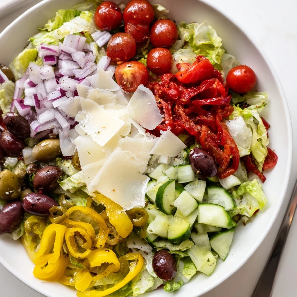Zesty Italian Chopped Salad With Parmesan And Peppers tossed in tangy lemon vinaigrette