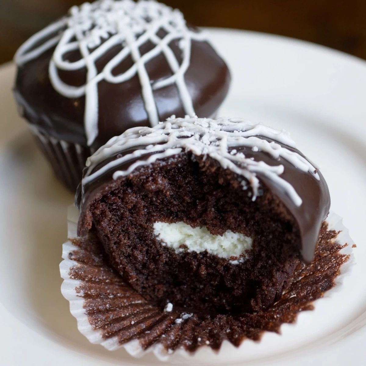 Moist Homemade Hostess Cupcakes oozing with fluffy marshmallow cream filling