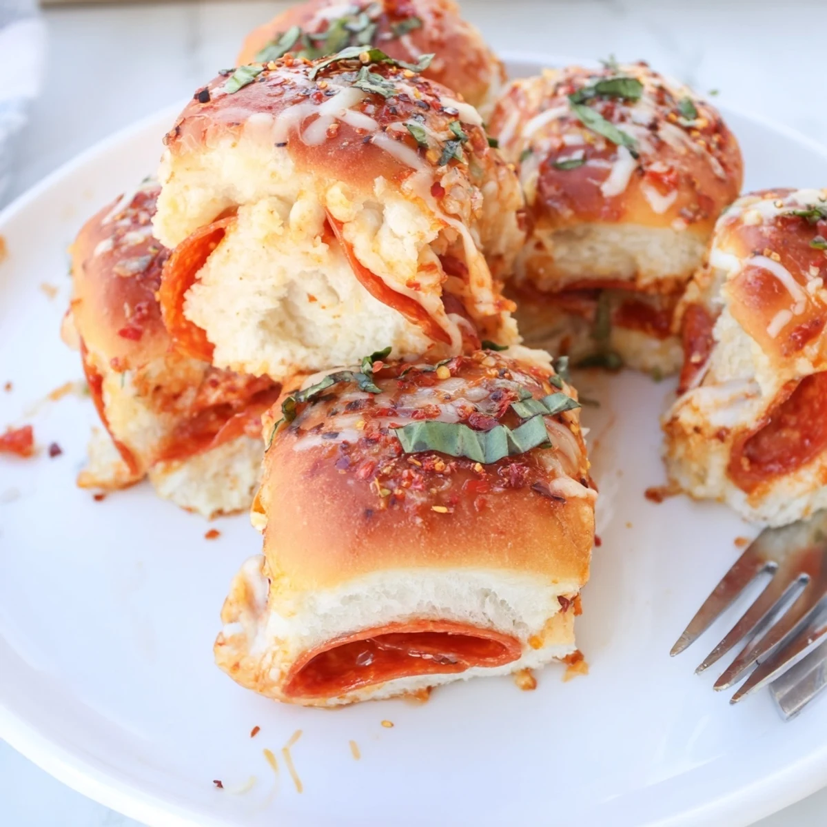 Golden hot honey pepperoni pizza sliders with gooey melted mozzarella and fresh basil