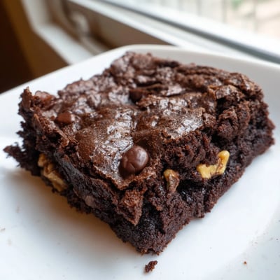 Warm chocolate brownie squares served with a generous scoop of vanilla bean ice cream