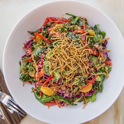 Colorful Mandarin Sesame Crunch Salad tossed in tangy ginger sesame dressing
